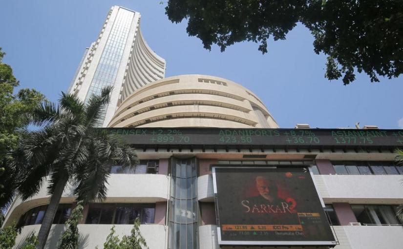 A screen displaying an image of India`s Prime Minister Narendra Modi is seen on a facade of the Bombay Stock Exchange (BSE) building in Mumbai, India, May 23, 2019. REUTERS