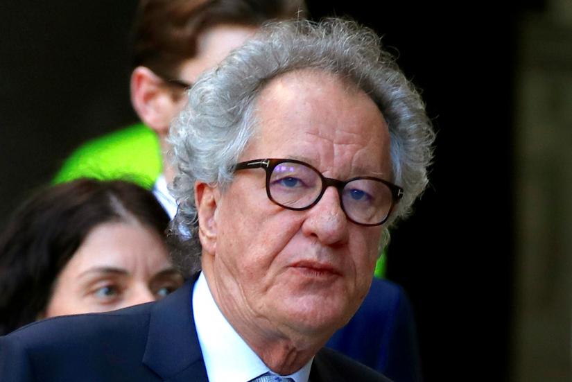 FILE PHOTO: Australian actor Geoffrey Rush reacts as he arrives at the Federal Court in Sydney, Australia, November 8, 2018. REUTERS