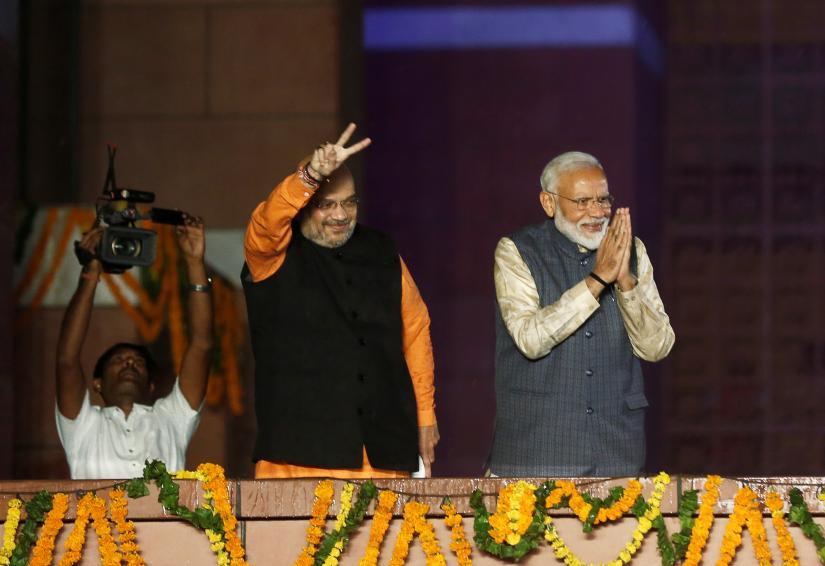 BJP President Amit Shah and Indian Prime Minister Narendra Modi gesture after the election results in New Delhi, India, May 23, 2019. REUTERS