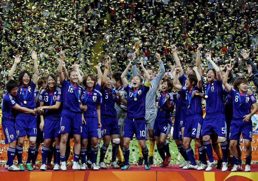 Football - Japan v United States of America FIFA Women`s World Cup Final 2011 - Frankfurt - 17/7/11 Homare Sawa of Japan lifts the trophy after winning the FIFA Women`s World Cup final/Action Images/File Photo