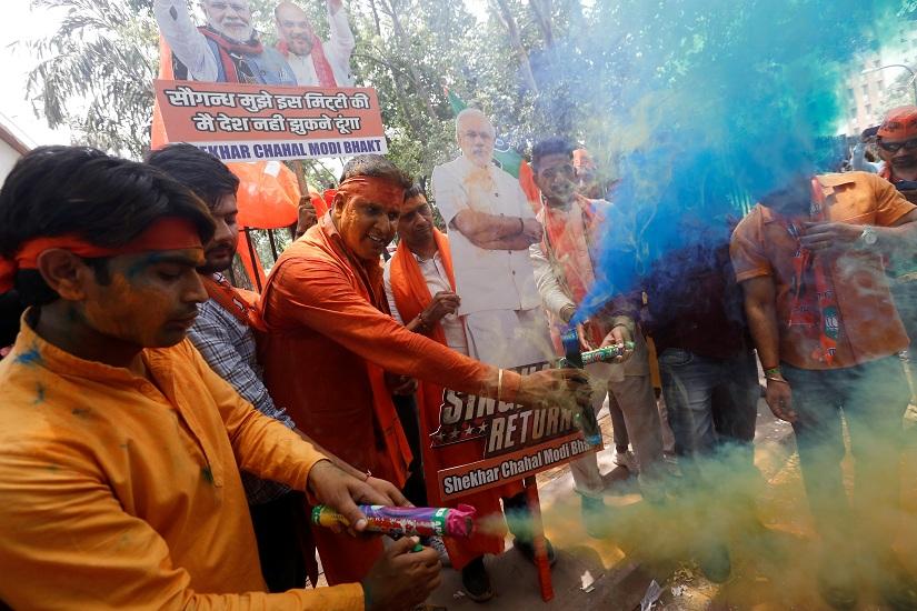BJP supporters celebrate after learning the initial election results outside the party headquarters in New Delhi, India, May 23, 2019. REUTERS