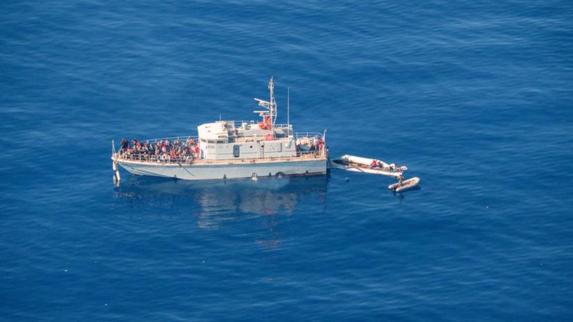Aerial view shows Libya`s coast guard ship with migrants on deck, in Search and Rescue (SAR) zone off Libya`s coast on May 11, 2019. The coast guard said it rescued 290 migrants on May 23, 2019. HANDOUT/REUTERS