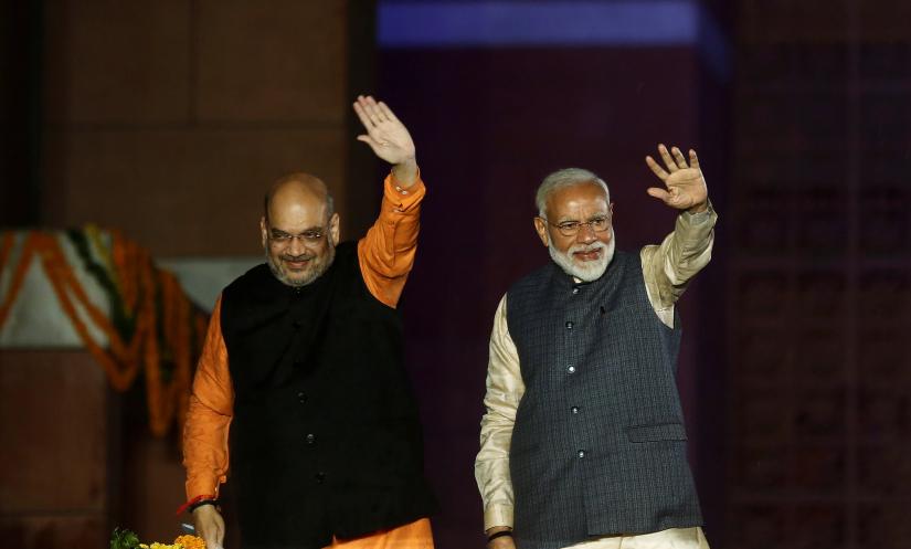 Indian Prime Minister Narendra Modi and Bharatiya Janata Party (BJP) President Amit Shah wave towards their supporters after the election results at party headquarter in New Delhi, India, May 23, 2019. REUTERS