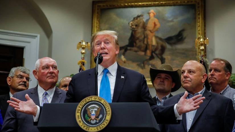 US President Donald Trump speaks to reporters on a range of issues during an event devoted to `America`s farmers and ranchers` in the Roosevelt Room of the White House in Washington, US, May 23, 2019. REUTERS