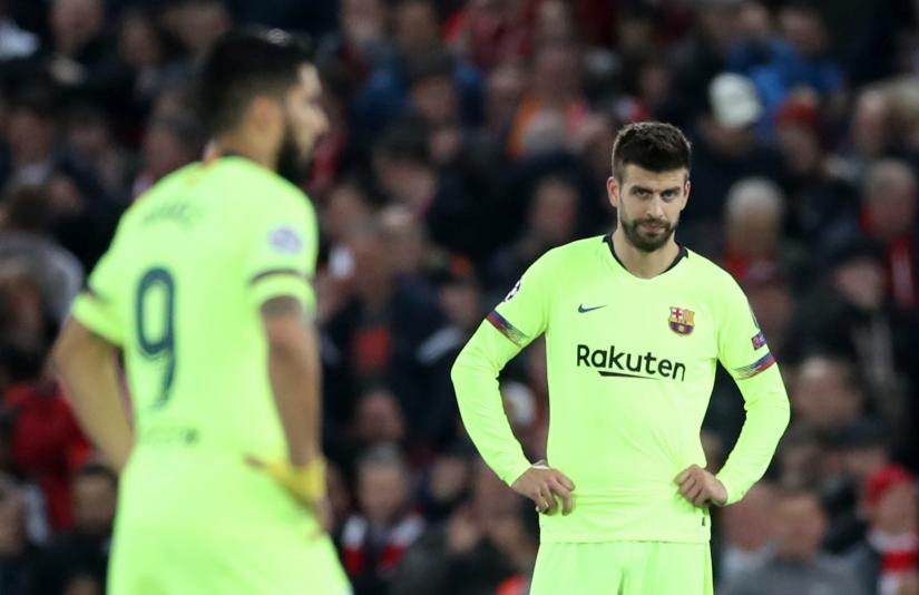 Football - Champions League Semi Final Second Leg - Liverpool v FC Barcelona - Anfield, Liverpool, Britain - May 7, 2019 Barcelona`s Luis Suarez and Gerard Pique react after conceding their third goal scored by Liverpool`s Georginio Wijnaldum Action Images via Reuters