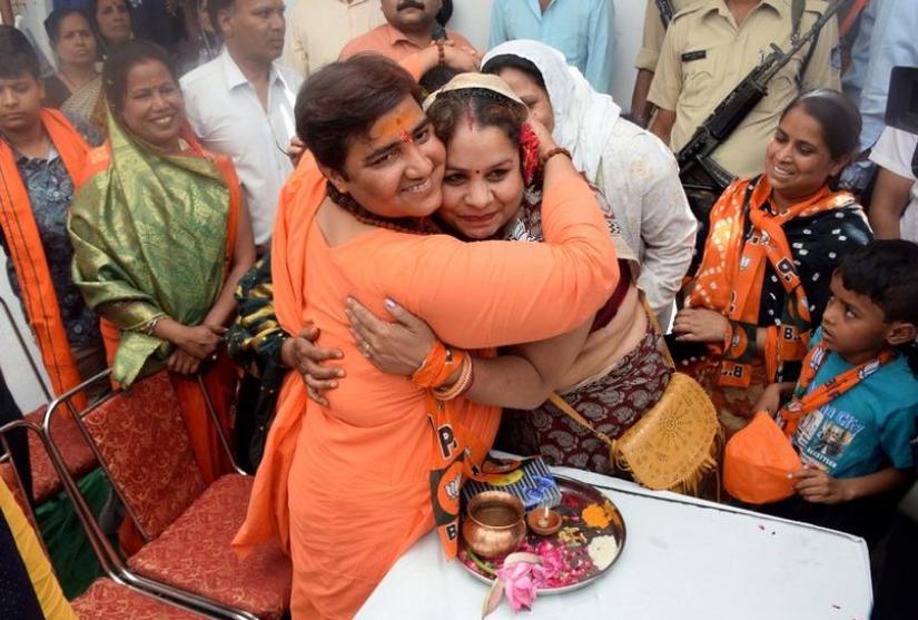 Pragya Thakur, a Bharatiya Janata Party (BJP) candidate in the parliamentary election, hugs a party supporter during her election campaign meeting in Bhopal, India, April 30, 2019. REUTERS/File Photo