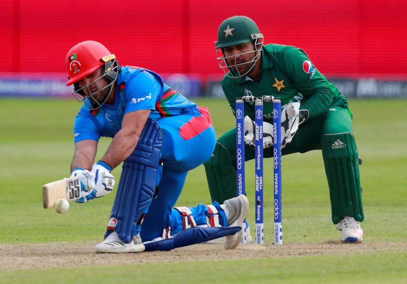 ICC Cricket World Cup Warm-Up Match - Pakistan v Afghanistan - County Ground, Bristol, Britain - May 24, 2019 Afghanistan`s Samiullah Shinwari and Pakistan`s Sarfaraz Ahmed in action Action Images via Reuters