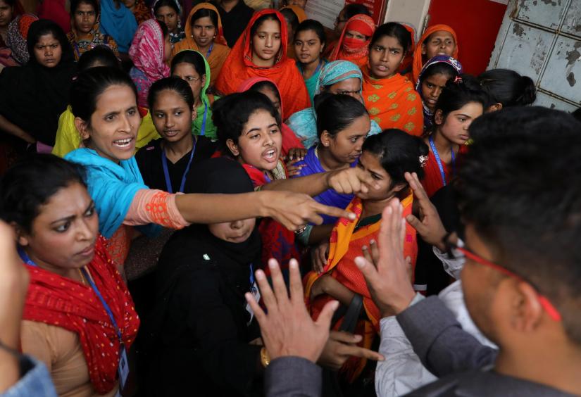 Garment workers shout as they protest for higher wages in Dhaka, Bangladesh January 12, 2019. REUTERS