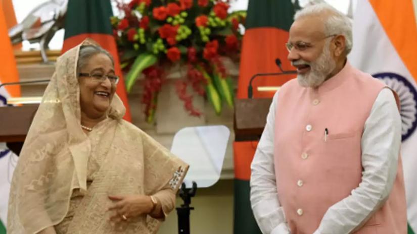 This April 2017 photo shows Prime Minister Sheikh Hasina sharing a light moment with her Indian counterpart Narendra Modi during an agreement signing ceremony in New Delhi. TIMES OF INDIA