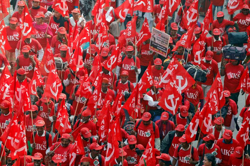 Indian farmers wave flags and shout slogans as they march towards Ramlila Ground during a protest rally demanding a complete waiver of debt and fixed assurances on crop prices, in New Delhi, India, November 29, 2018 REUTERS/File Photo