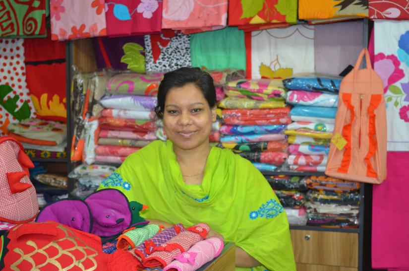 An entrepreneur is seen at her shop which Joyeeta Foundation helped her start financially. JOYEETA FOUNDATION