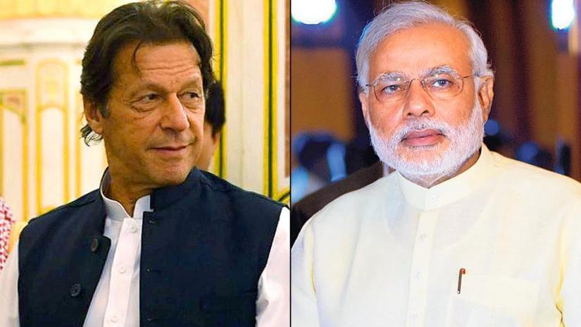 Combination of photos shows Pakistani Prime Minister Imran Khan and Indian Narendra Modi.