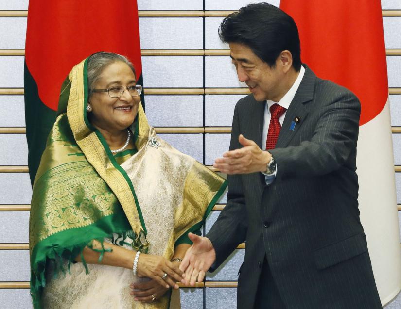 This December 2017 photo shows Prime Minister Sheikh Hasina and her Japanese counterpart Shinzo Abe sharing good vibes. COURTESY