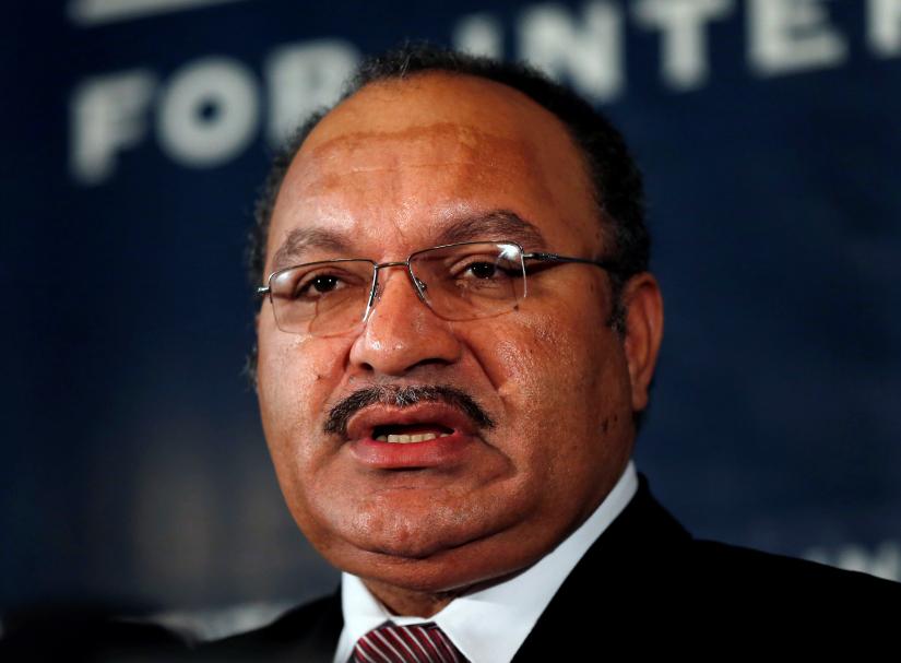 FILE PHOTO: Papua New Guinea`s then Prime Minister Peter O`Neill makes an address to the Lowy Institute in Sydney, Australia November 29, 2012. REUTERS