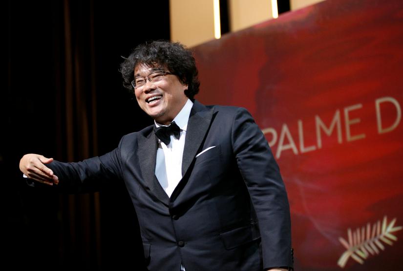 72nd Cannes Film Festival - Closing ceremony - Cannes, France, May 25, 2019. Director Bong Joon-ho, Palme d`Or award winner for his film `Parasite` (Gisaengchung), reacts. REUTERS