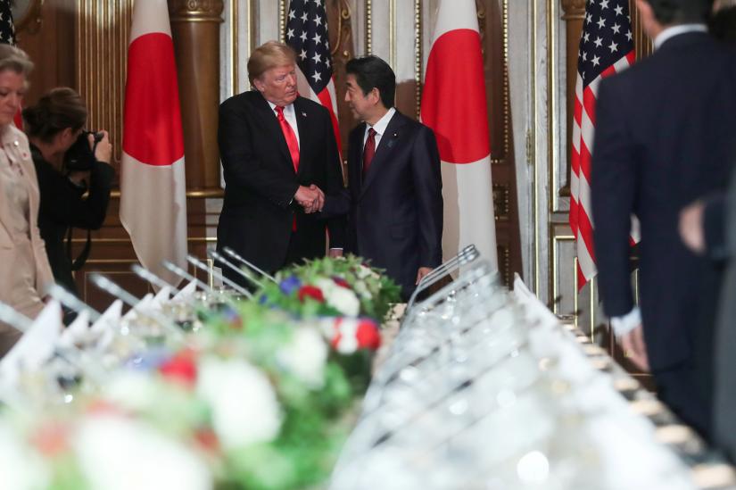 U.S. President Donald Trump shakes hands with Japan`s Prime Minister Shinzo Abe before their working lunch in Tokyo, Japan May 27, 2019. REUTERS