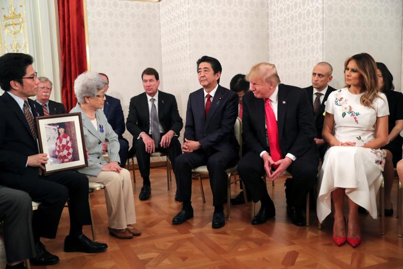 U.S. President Donald Trump, first lady Melania Trump and Japan`s Prime Minister Shinzo Abe meet with family members of people abducted by North Korea, at Akasaka Palace in Tokyo, Japan May 27, 2019. REUTERS