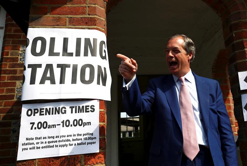 Brexit Party leader Nigel Farage gestures as he leaves a polling station after voting in the European elections, in Biggin Hill, Britain, May 23, 2019. REUTERS