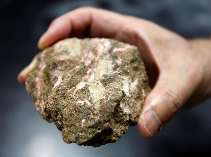 A bastnaesite mineral containing rare earth is pictured at a laboratory of Yasuhiro Kato, an associate professor of earth science at the University of Tokyo, July 5, 2011. REUTERS/File Photo