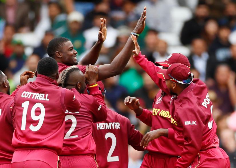 West Indies` Jason Holder celebrates with team mates after taking the wicket of Pakistan`s Sarfaraz Ahmed at Trent Bridge, Nottingham, Britain on May 31, 2019. Reuters