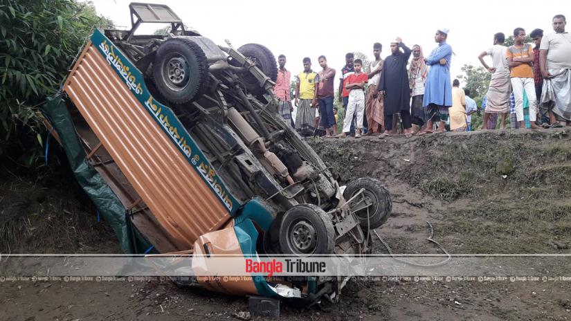 People seen standing beside wreckage of a human hauler, locally known as a leguna, damaged in an accident in Dakshin Sunamganj upazila on Sunday, June 2, 2019 Bangla Tribune