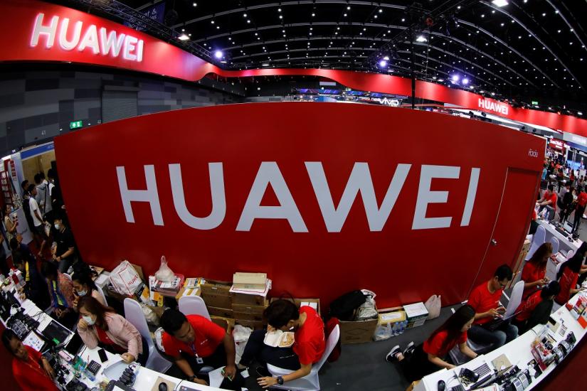 Workers sit at the Huawei stand at the Mobile Expo in Bangkok, Thailand May 31, 2019.REUTERS