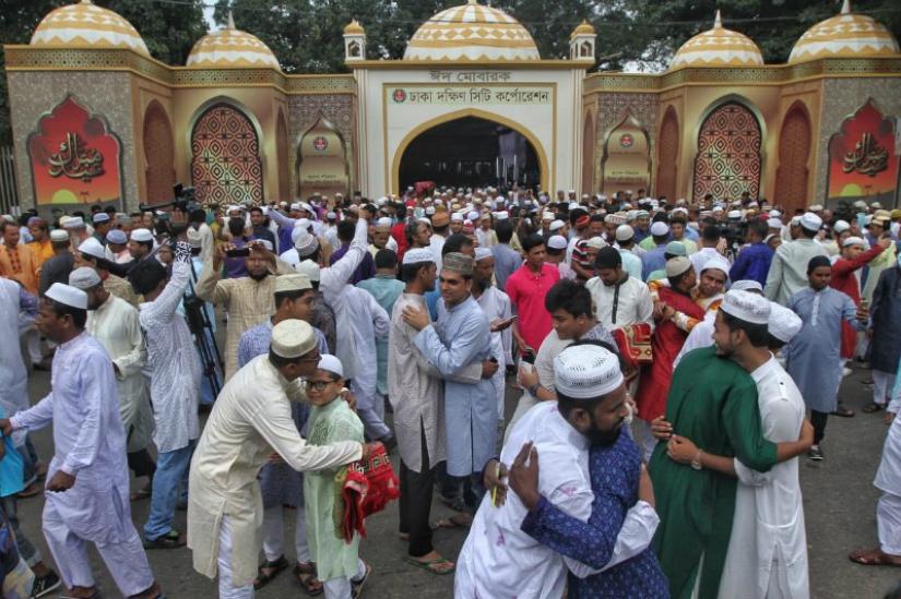 Muslims embrace each other to share the joy and unity of Eid at the National Eidgah. File Photo/Rajib Dhar