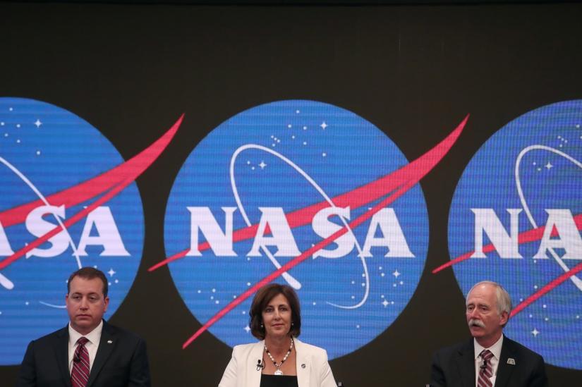 CFO NASA Headquarters` Jeff DeWit, Robyn Gatens, Deputy Director, International Space Station at NASA Headquarters, and Bill Gerstenmaier, Associate Administrator, NASA`s Human Exploration and Operations Mission Directorate, NASA Headquarters, sit during a news conference announcing that NASA is opening the International Space Station for commercial business, so U.S. industry innovation and ingenuity can accelerate a commercial economy in low-Earth orbit, at the NASDAQ Market site at Times Square in New York City, U.S., June 7, 2019. REUTERS