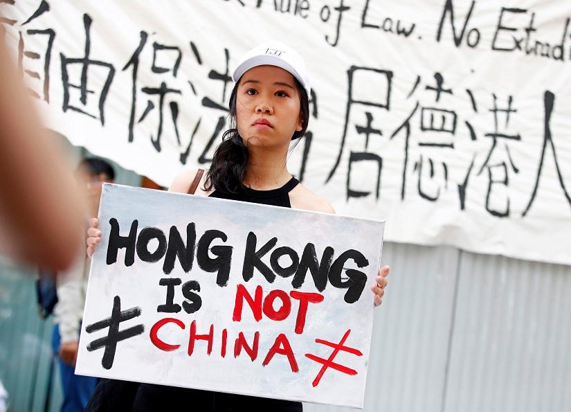 People attend a protest against proposed extradition bill of Chinese-ruled Hong Kong with China, in Berlin, Germany, June 9, 2019. REUTERS