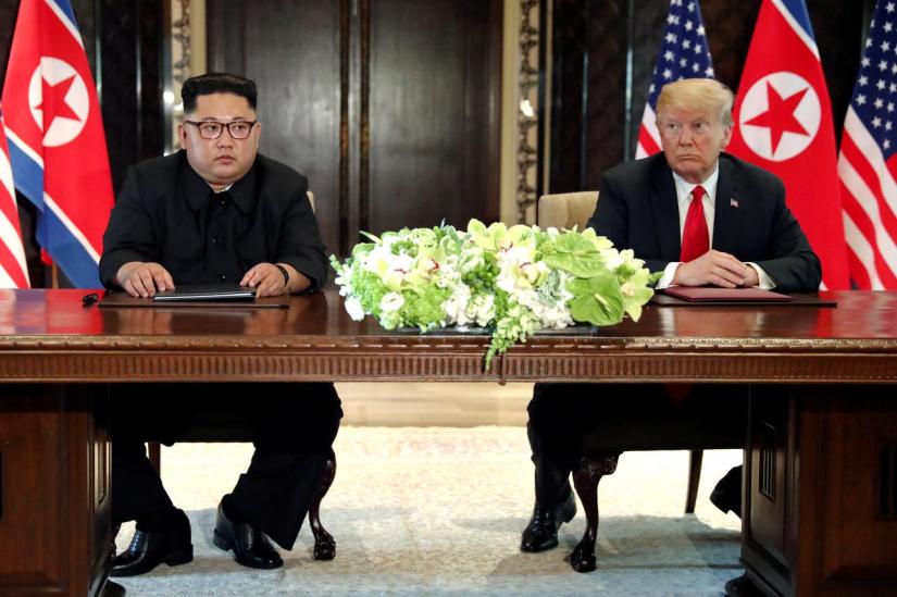 US President Donald Trump and North Korea`s leader Kim Jong Un hold a signing ceremony at the conclusion of their summit at the Capella Hotel on the resort island of Sentosa, Singapore June 12, 2018. REUTERS/File Photo