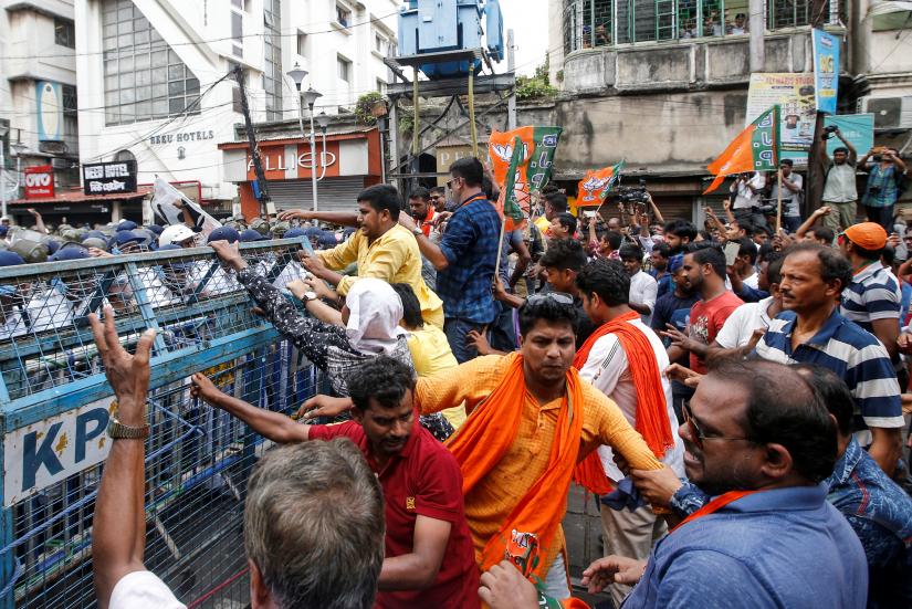 Supporters of India’s Bharatiya Janata Party (BJP) break barricades during a protest against what they call violence against their party workers in the state of West Bengal, in Kolkata, India, June 12, 2019. REUTERS