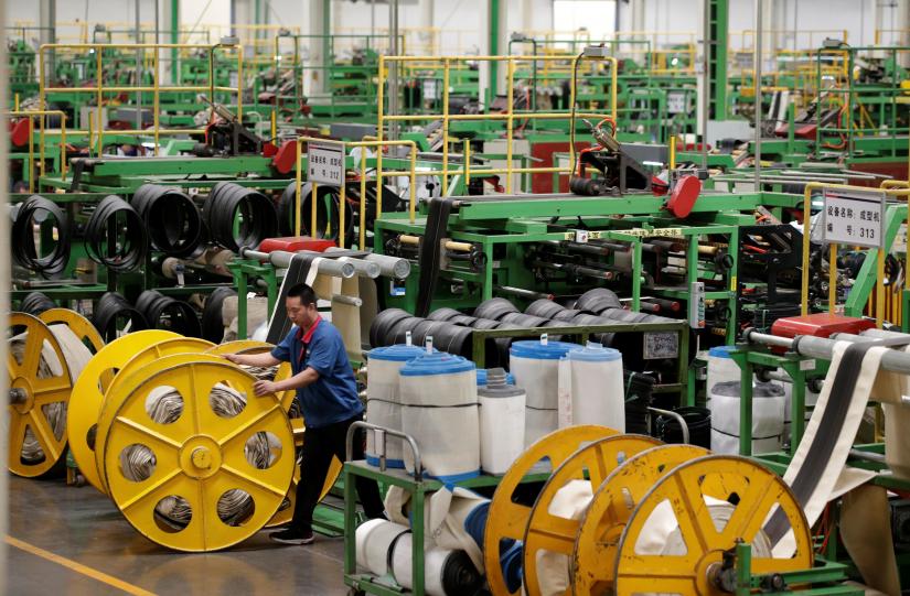 An employee works on the production line of a tyre factory under Tianjin Wanda Tyre Group, which exports its products to countries such as U.S. and Japan, in Xingtai, Hebei province, China May 21, 2019. REUTERS