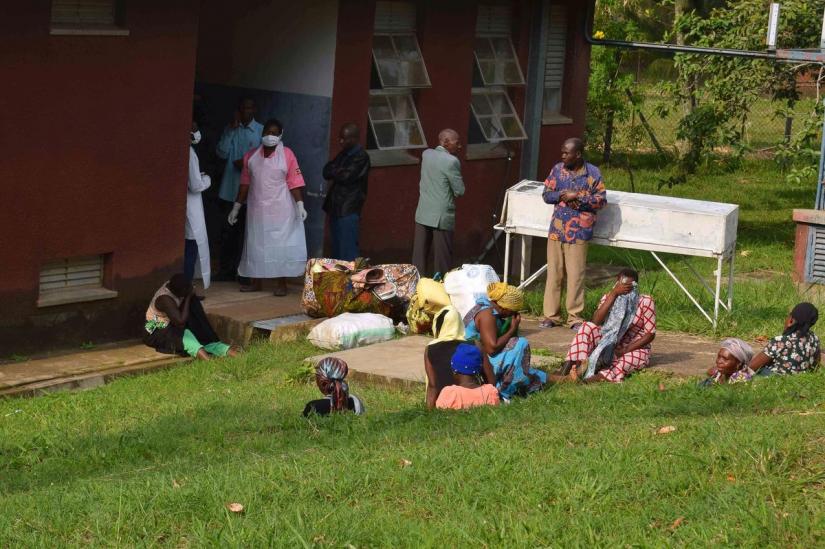 People are seen in the courtyard as Ugandan medical staff inspect the ebola preparedness facilities at the Bwera general hospital near the border with the Democratic Republic of Congo in Bwera, Uganda, June 12, 2019. REUTERS