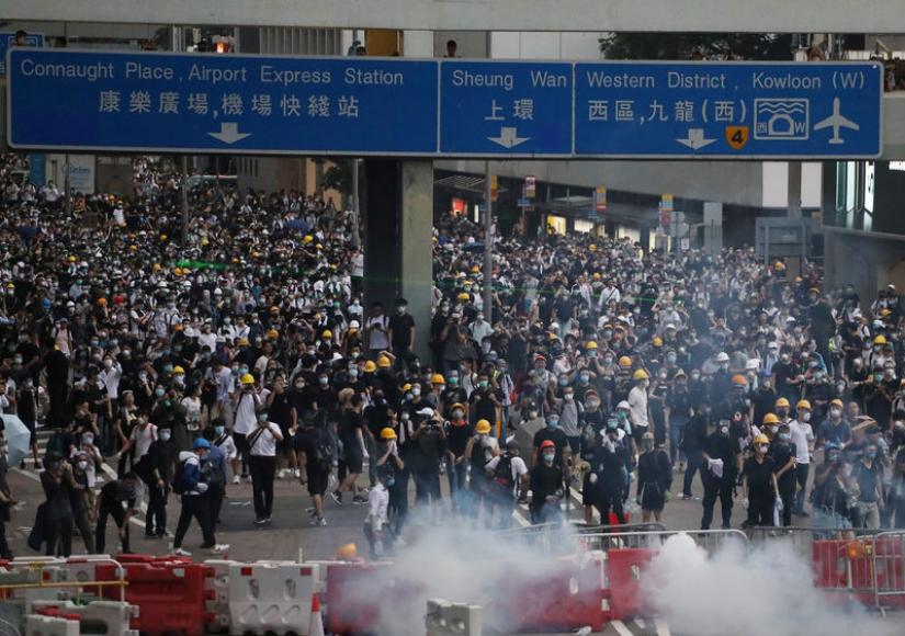 Protesters march along a road demonstrating against a proposed extradition bill in Hong Kong, China June 12, 2019. REUTERS