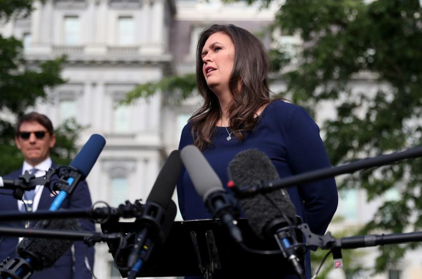 US White House Press Secretary Sarah Huckabee Sanders speaks to the news media after giving an interview to Fox News outside of the White House in Washington, US May 22, 2019. REUTERS.