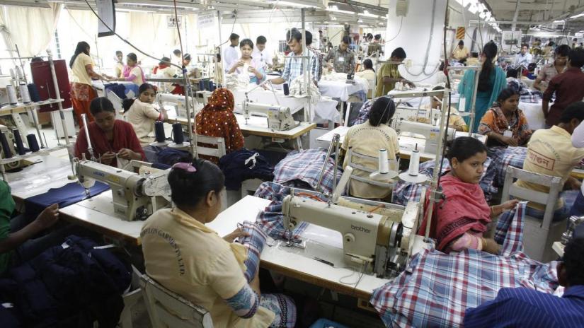 Employees work in a factory of Babylon Garments in Dhaka Jan 3, 2014. REUTERS/File Photo