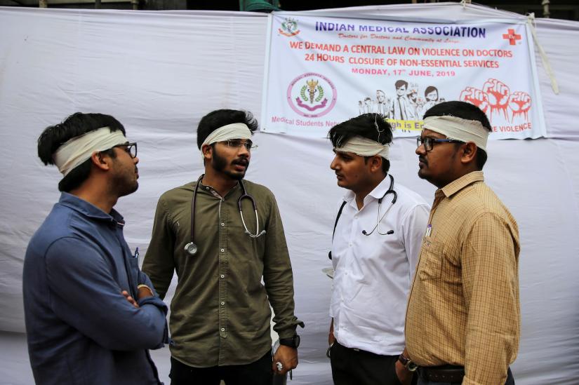 Doctors participate in a protest called by Indian Medical Association (IMA), during a nationwide doctors strike demanding security after the recent assaults on them by the patients` relatives, in New Delhi, India, June 17, 2019. REUTERS