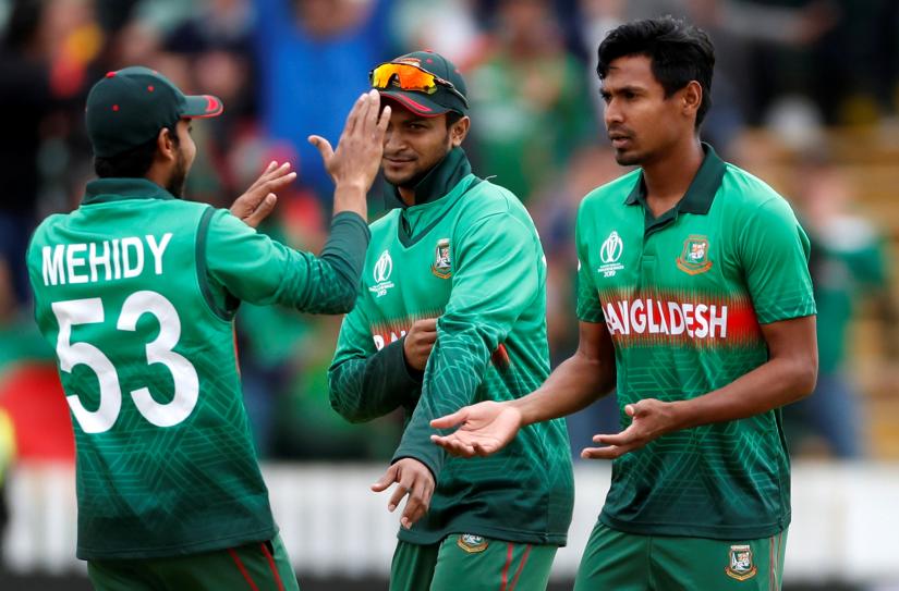 Cricket - ICC Cricket World Cup - West Indies v Bangladesh - The County Ground, Taunton, Britain - June 17, 2019 Bangladesh`s Mustafizur Rahman celebrates the wicket of West Indies Andre Russell Action Images via Reuters