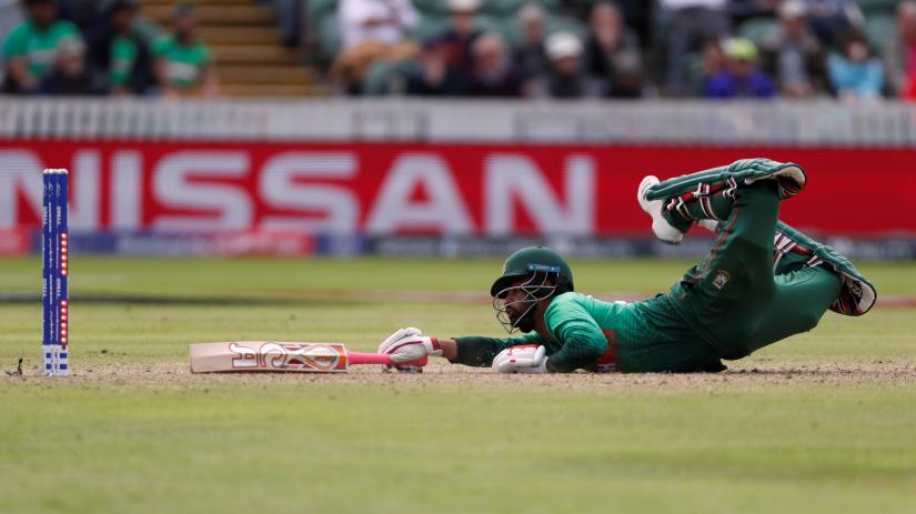 Cricket - ICC Cricket World Cup - West Indies v Bangladesh - The County Ground, Taunton, Britain - June 17, 2019 Bangladesh`s Tamim Iqbal is run out by West Indies` Sheldon Cottrell Action Images via Reuters