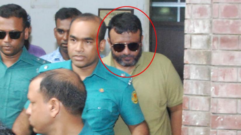 FILE PHOTO: Ex-Sonagazi OC Moazzem Hossain being brought to a Dhaka court on Jun 17, 2019. FOCUS BANGLA