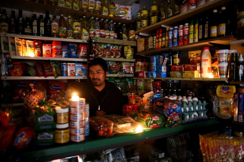 A vendor waits for customers during a national blackout, in Buenos Aires, Argentina June 16, 2019. REUTERS