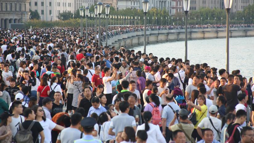 Visitors throng the Bund, Shanghai`s waterfront, on the second day of the `Golden Week` holiday on Oct. 2, 2018.Reuters