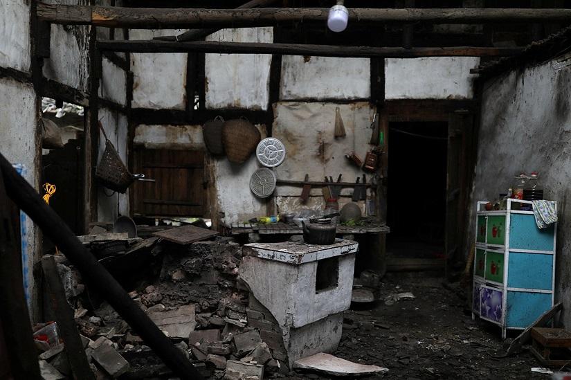A kitchen is seen damaged inside a house after earthquakes hit Changning county in Yibin, Sichuan province, China June 18, 2019. REUTERS