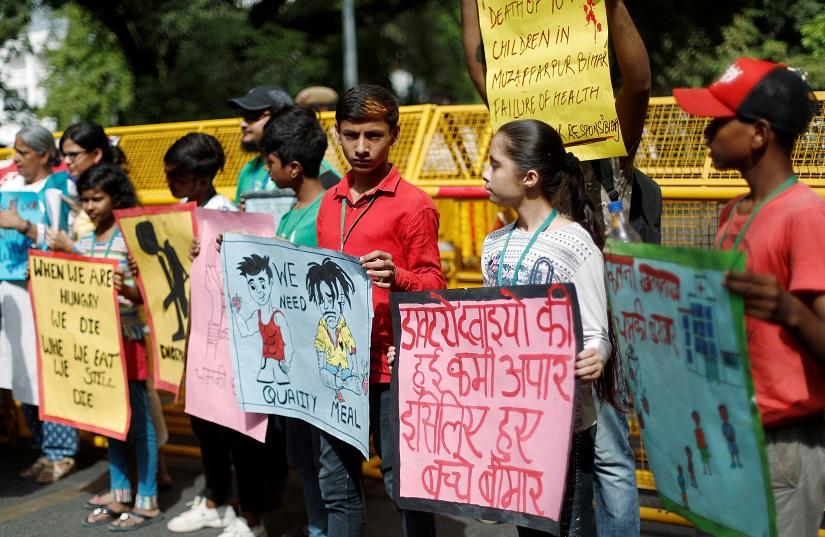 Children hold placards during a protest against the deaths of children who have died this month from encephalitis, commonly known as brain fever, in the eastern Indian state of Bihar, in New Delhi, India, June 17, 2019. REUTERS