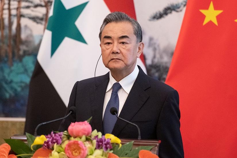 Chinese Foreign Minister Wang Yi listens to Syrian Foreign Minister Walid Muallem (unseen) during a meeting at Diaoyutai State Guesthouse in Beijing on June 18, 2019. Fred Dufour/Pool via REUTERS