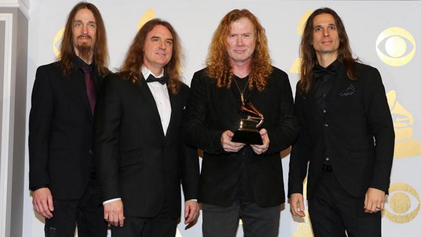 Members of Megadeth hold the award for Best Metal Performance for `Dystopia` at the 59th Annual Grammy Awards in Los Angeles, California, US , Feb 12, 2017. Guitarist and singer Dave Mustaine is second from right. REUTERS/File Photo