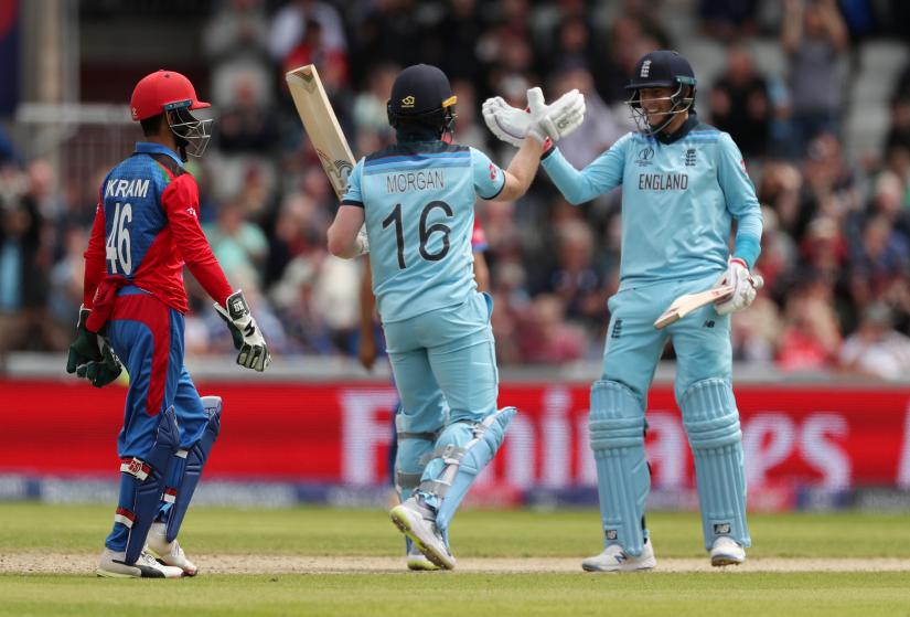 Cricket - ICC Cricket World Cup - England v Afghanistan - Old Trafford, Manchester, Britain - June 18, 2019 England`s Eoin Morgan celebrates his century with Joe Root Action Images via Reuters