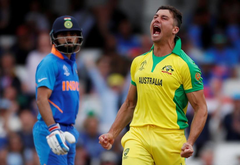 ICC Cricket World Cup - India v Australia - The Oval, London, Britain - June 9, 2019 Australia`s Marcus Stoinis celebrates taking the wicket of India`s MS Dhoni Action Images via Reuters