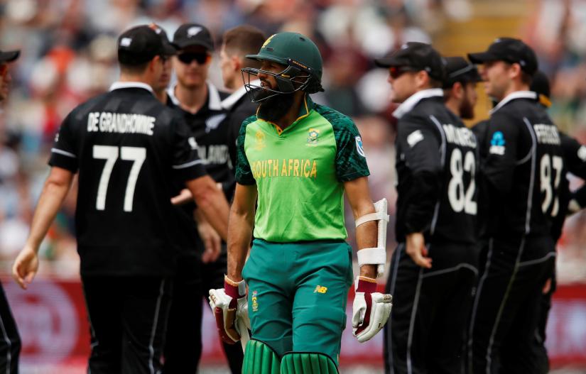 ICC Cricket World Cup - New Zealand v South Africa - Edgbaston, Birmingham, Britian - June 19, 2019 South Africa`s Hashim Amla looks dejected as he walks off after being bowled by New Zealand`s Mitchell Santner. Action Images via Reuters