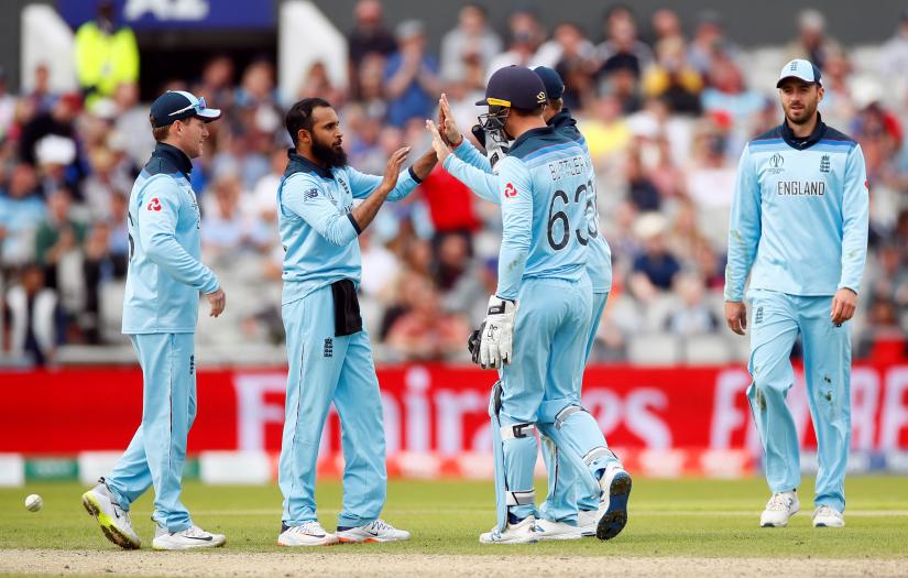 Cricket - ICC Cricket World Cup - England v Afghanistan - Old Trafford, Manchester, Britain - June 18, 2019 England`s Adil Rashid celebrates with team mates after taking the wicket of Afghanistan`s Asghar Afghan Action Images via Reuters